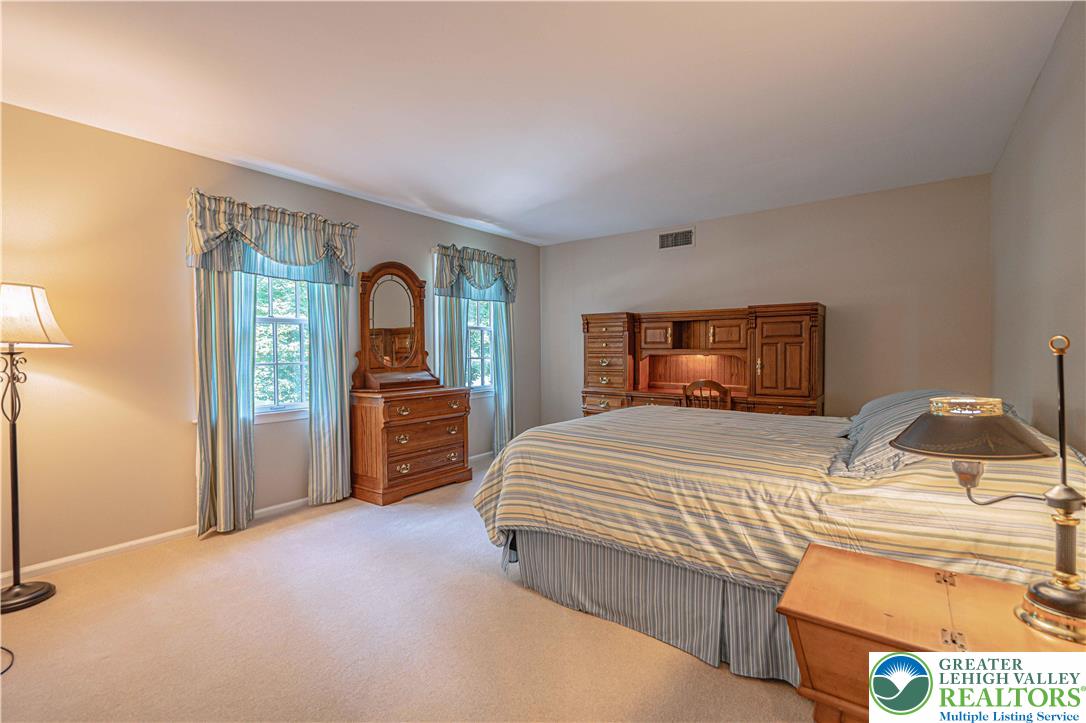 1434 Colgate Drive Bethlehem, PA 18017 - Photo 27 of 37 a bedroom with a bed and a dresser