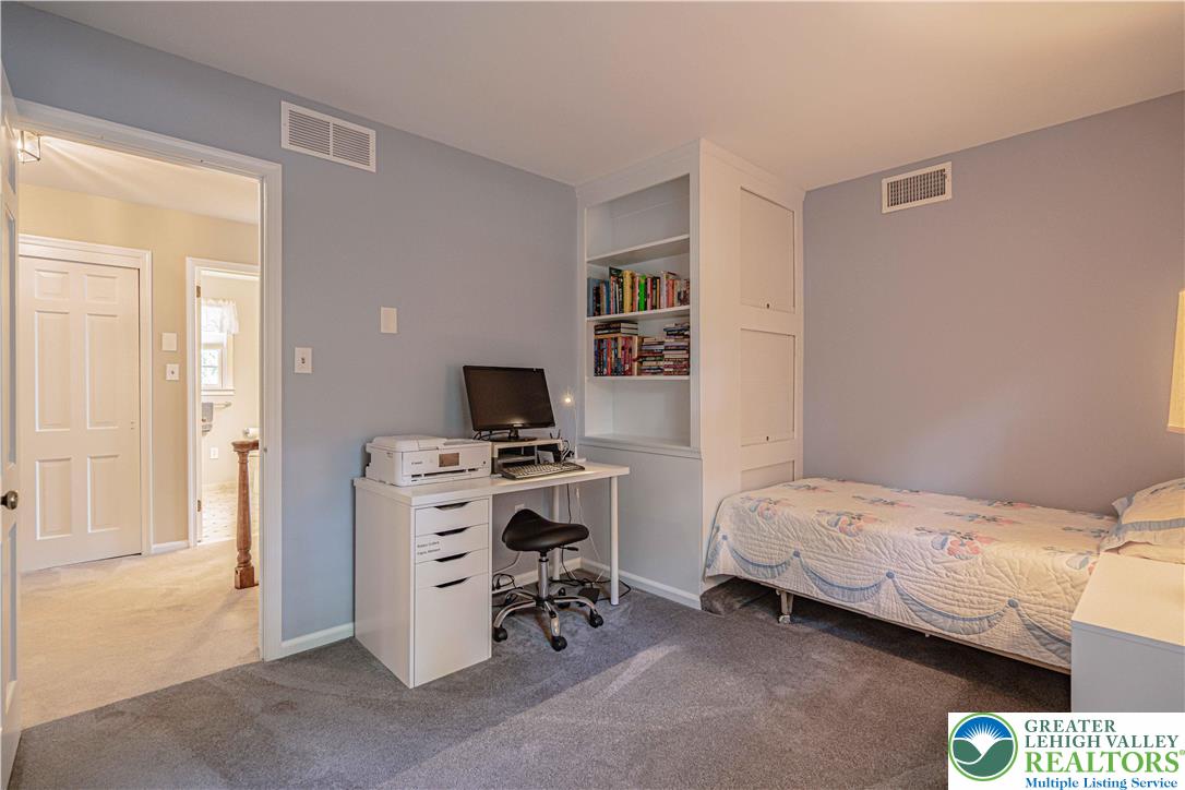 1434 Colgate Drive Bethlehem, PA 18017 - Photo 30 of 37 a bedroom with a bed and a tv