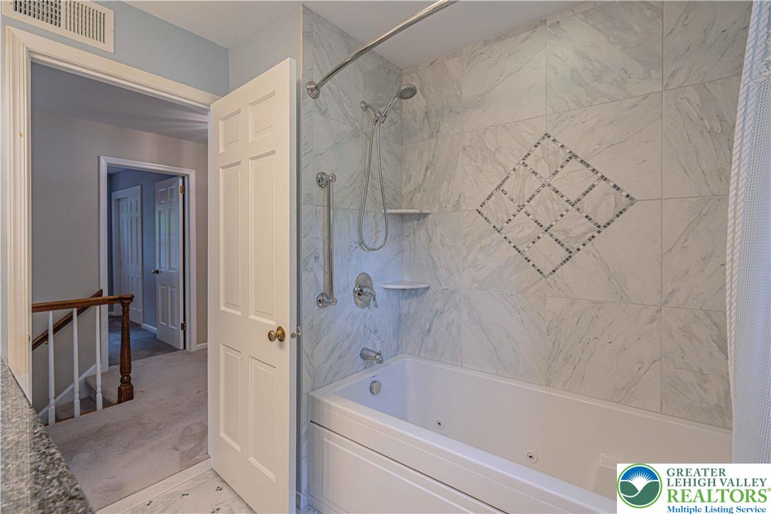 1434 Colgate Drive Bethlehem, PA 18017 - Photo 32 of 37 a bathroom with a bathtub and a shower