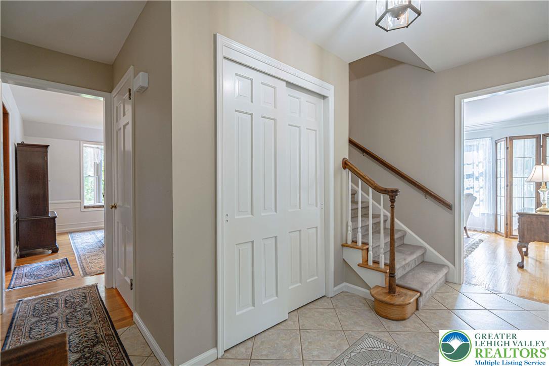 1434 Colgate Drive Bethlehem, PA 18017 - Photo 4 of 37 a view of a hallway with wooden floor and staircase
