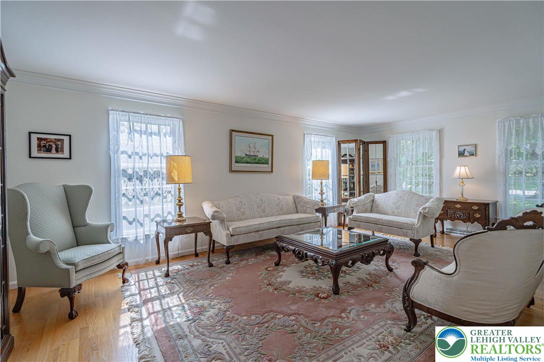 1434 Colgate Drive Bethlehem, PA 18017 - Photo 6 of 37 a living room with furniture a rug and a window