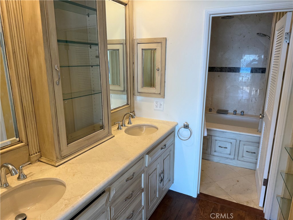 87 A Surfside Avenue Surfside, CA 90743 - Photo 11 of 14 a bathroom with a sink double vanity and a mirror