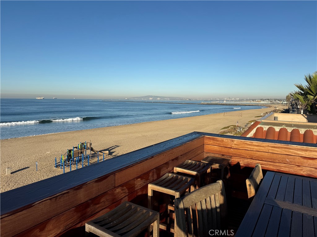87 A Surfside Avenue Surfside, CA 90743 - Photo 6 of 14 a view of a roof deck with wooden floor and seating space