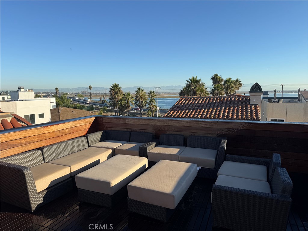 87 A Surfside Avenue Surfside, CA 90743 - Photo 7 of 14 a view of a terrace with furniture and a table