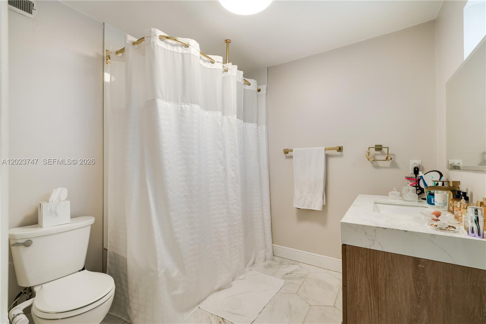 11515 Southwest 81st Road, Unit 11515 Pinecrest, FL 33156 - Photo 26 of 33 a bathroom with a sink a toilet and shower
