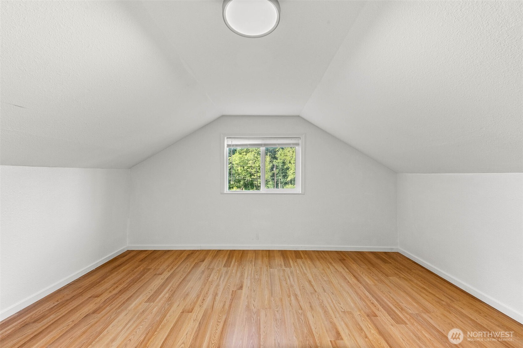 172 South Bank Road Elma, WA 98541 - Photo 30 of 40 an empty room with wooden floor and windows