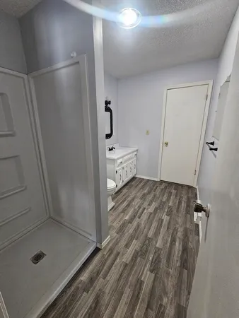 a bathroom with a sink and shower