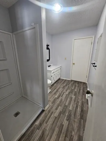 a bathroom with a sink and shower