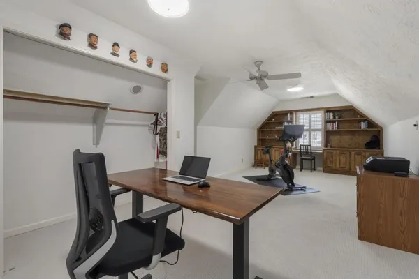 a view of a workspace with furniture