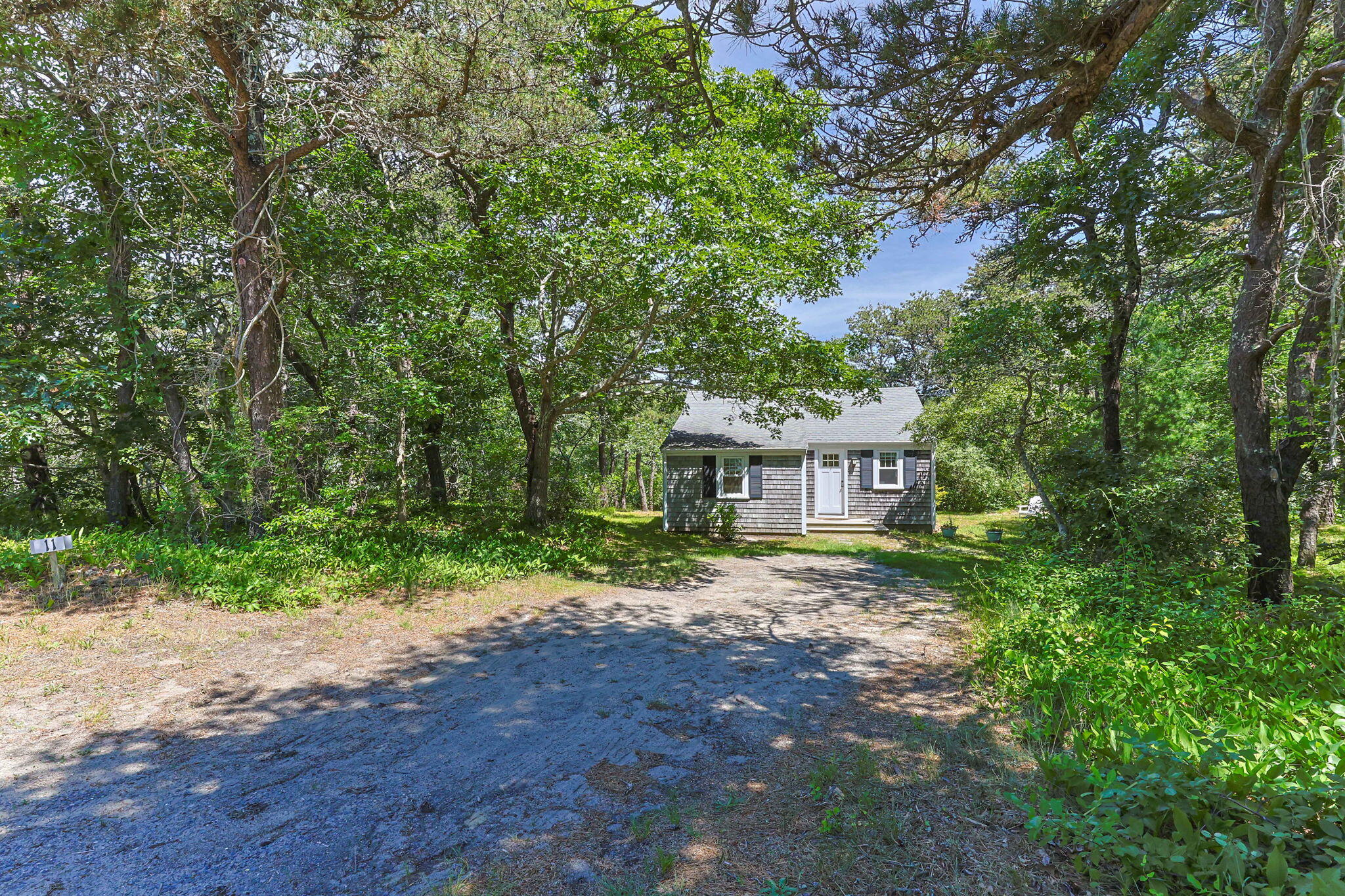 11 Whitmanville Road Truro, MA 02666 - Photo 29 of 31 a view of a house with a tree