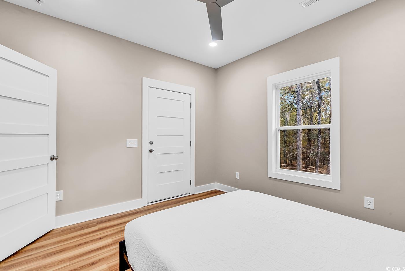 32 Old Place Kingstree, SC 29556 - Photo 12 of 40 Bedroom featuring light wood-type flooring, ceiling fan, and recessed lighting