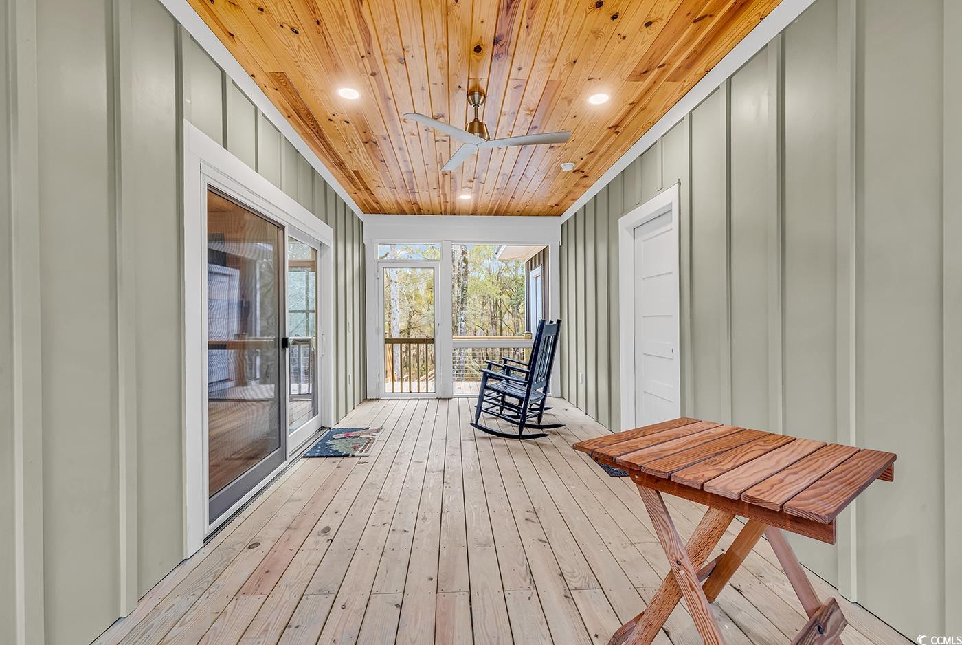 32 Old Place Kingstree, SC 29556 - Photo 15 of 40 Wooden deck featuring a ceiling fan and a sunroom