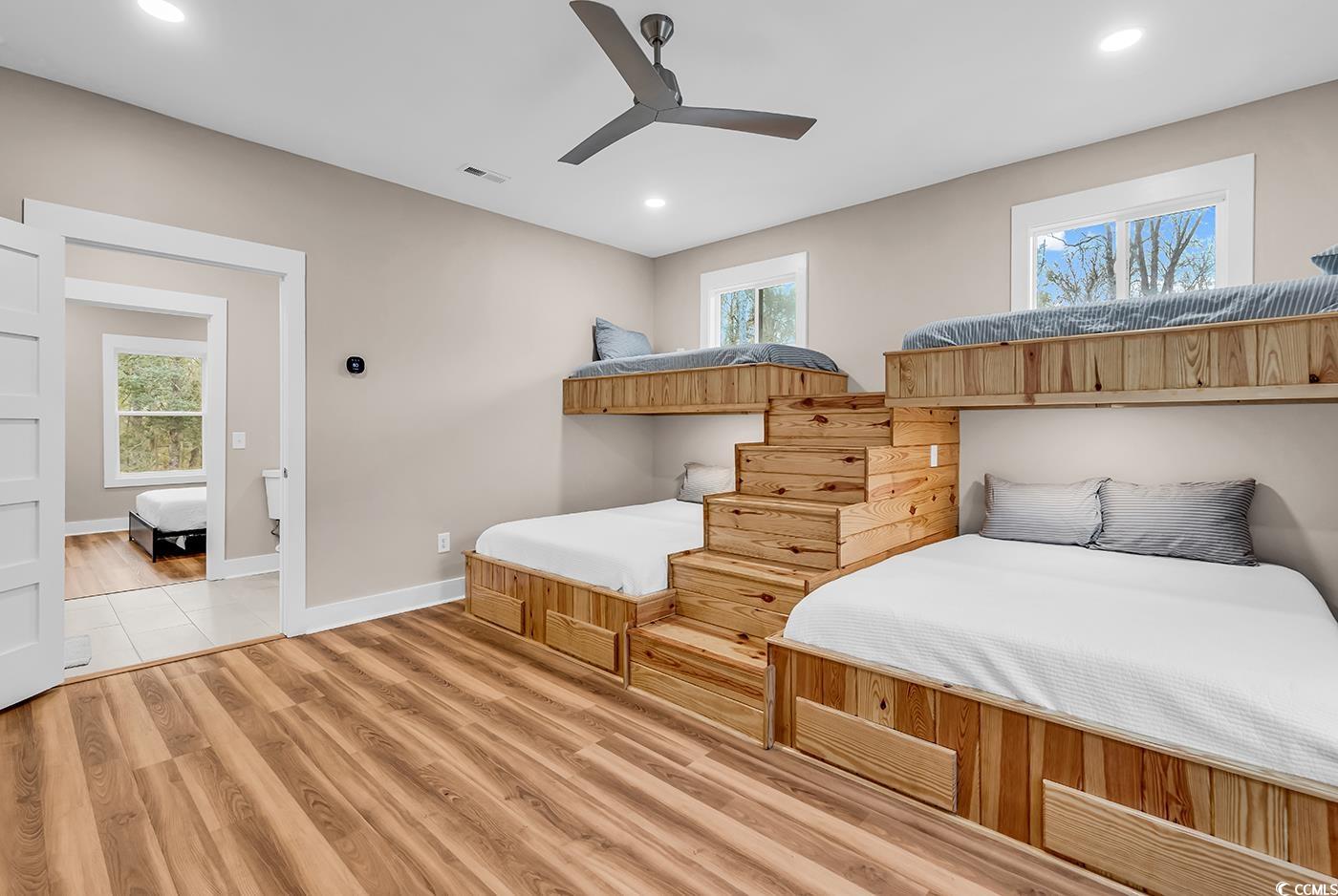 32 Old Place Kingstree, SC 29556 - Photo 7 of 40 Bedroom featuring multiple windows, light wood-style flooring, a ceiling fan, and recessed lighting