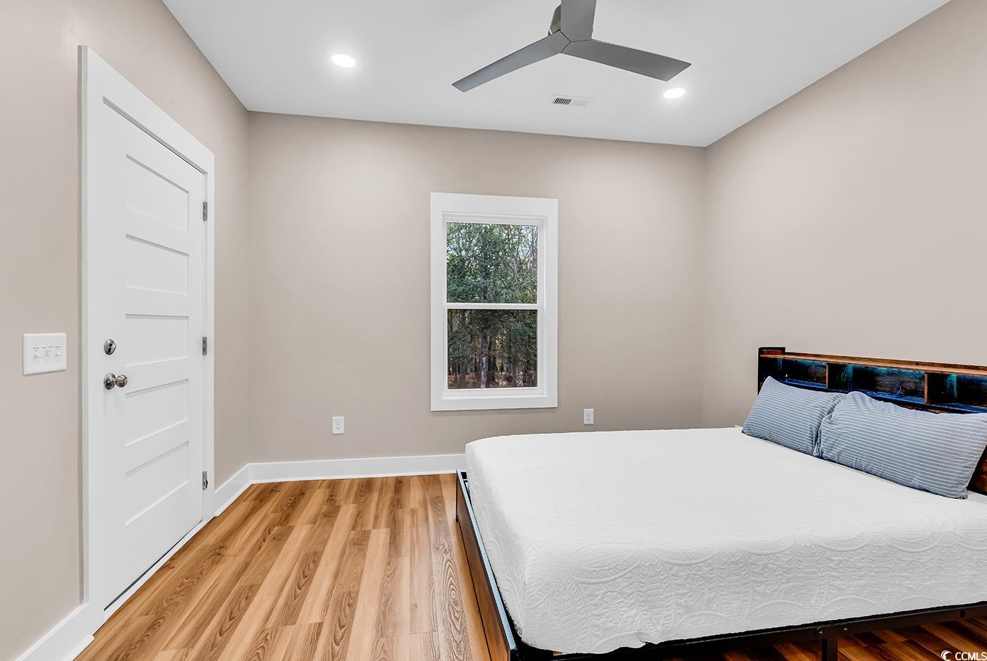 32 Old Place Kingstree, SC 29556 - Photo 10 of 40 Bedroom featuring light wood-style flooring, a ceiling fan, and recessed lighting