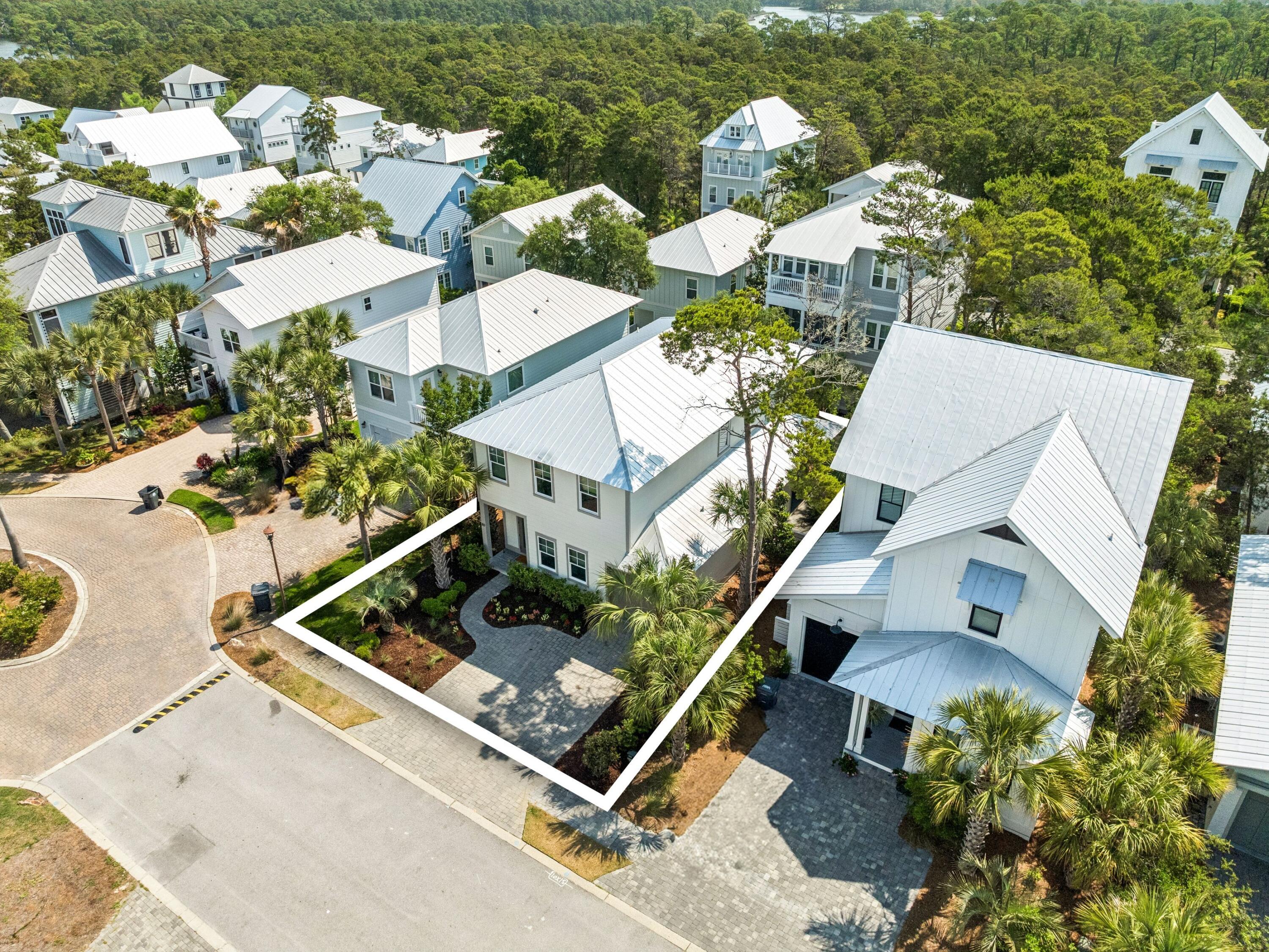 80 Grande Pointe Drive Inlet Beach, FL 32461 - Photo 6 of 68 an aerial view of a house with a garden