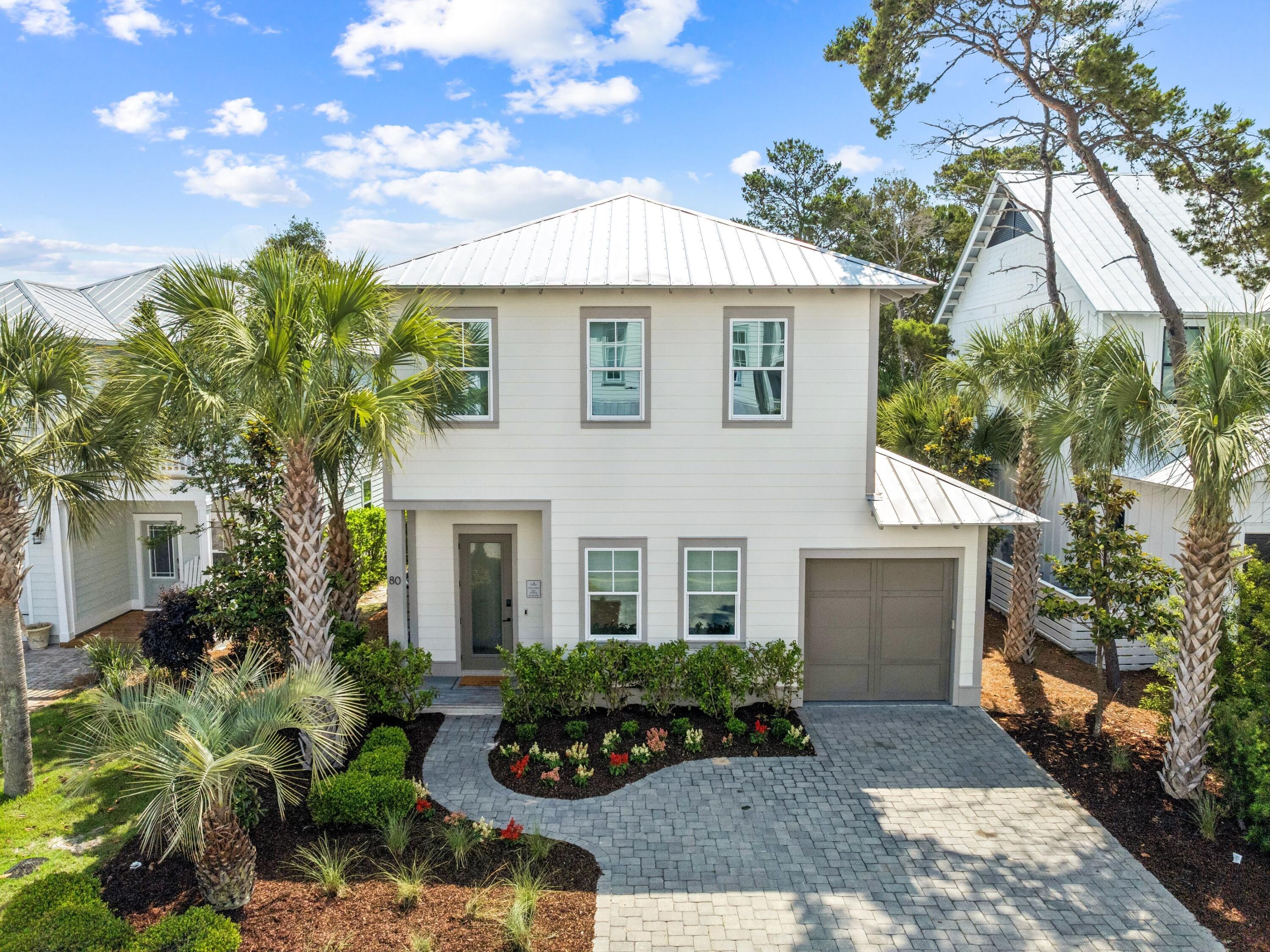 80 Grande Pointe Drive Inlet Beach, FL 32461 - Photo 8 of 68 a front view of a house with a garden