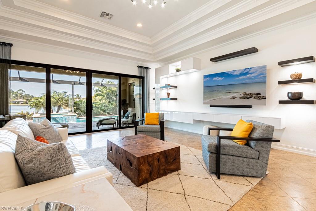 9380 Glenforest Drive Naples, FL 34120 - Photo 11 of 49 a living room with furniture and large window
