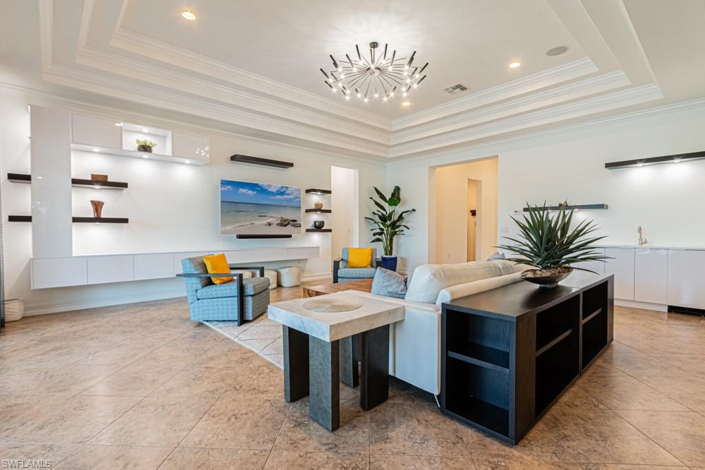 9380 Glenforest Drive Naples, FL 34120 - Photo 14 of 49 a living room with stainless steel appliances kitchen island granite countertop furniture and a kitchen view