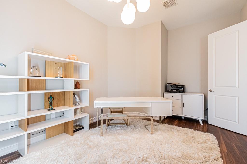 9380 Glenforest Drive Naples, FL 34120 - Photo 28 of 49 a living room with furniture and white walls