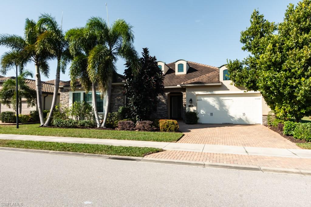 9380 Glenforest Drive Naples, FL 34120 - Photo 3 of 49 a view of a street with a houses