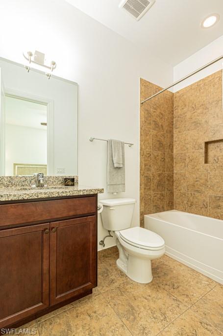 9380 Glenforest Drive Naples, FL 34120 - Photo 34 of 49 a bathroom with a granite countertop toilet a sink and a bathtub