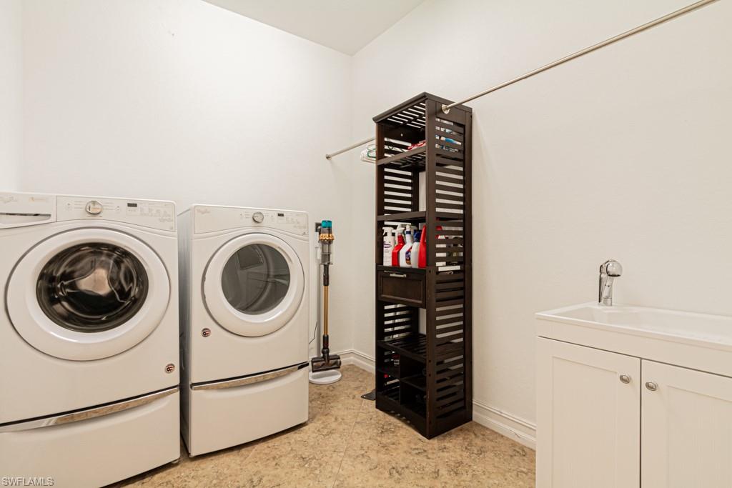9380 Glenforest Drive Naples, FL 34120 - Photo 39 of 49 a utility room with dryer and washer