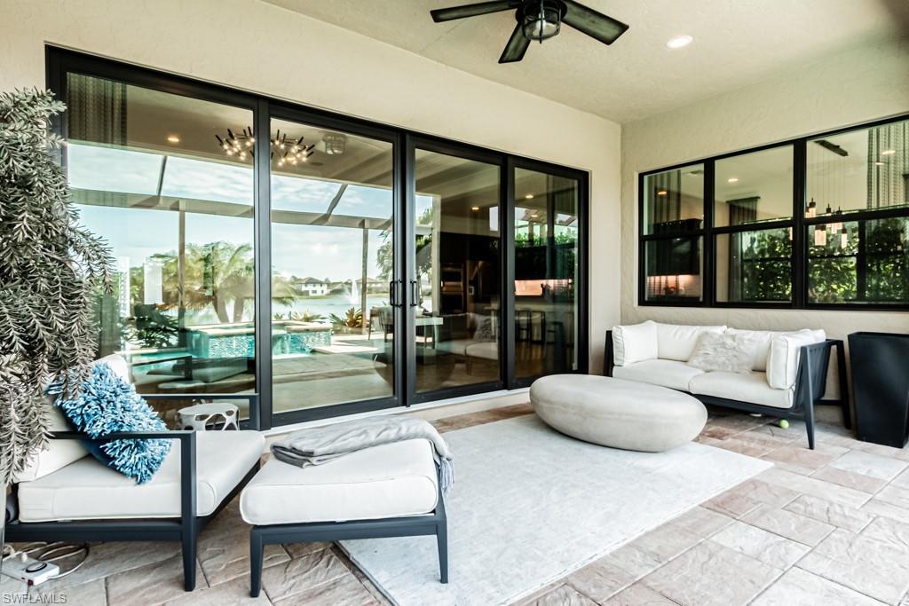 9380 Glenforest Drive Naples, FL 34120 - Photo 40 of 49 a living room with furniture and a large window