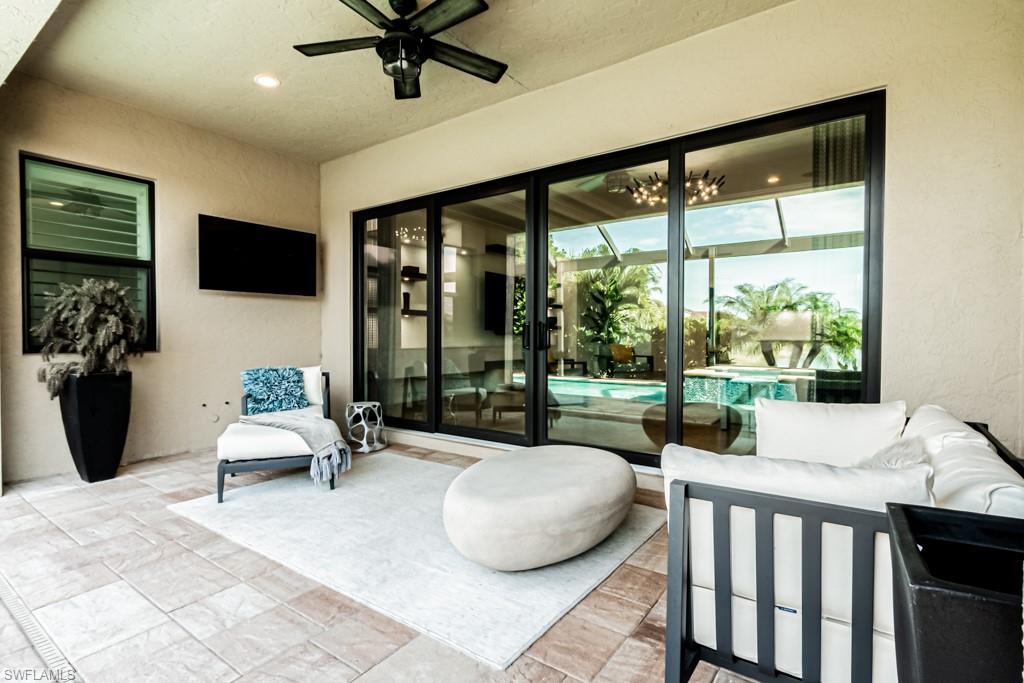 9380 Glenforest Drive Naples, FL 34120 - Photo 41 of 49 a bedroom with furniture and a large window