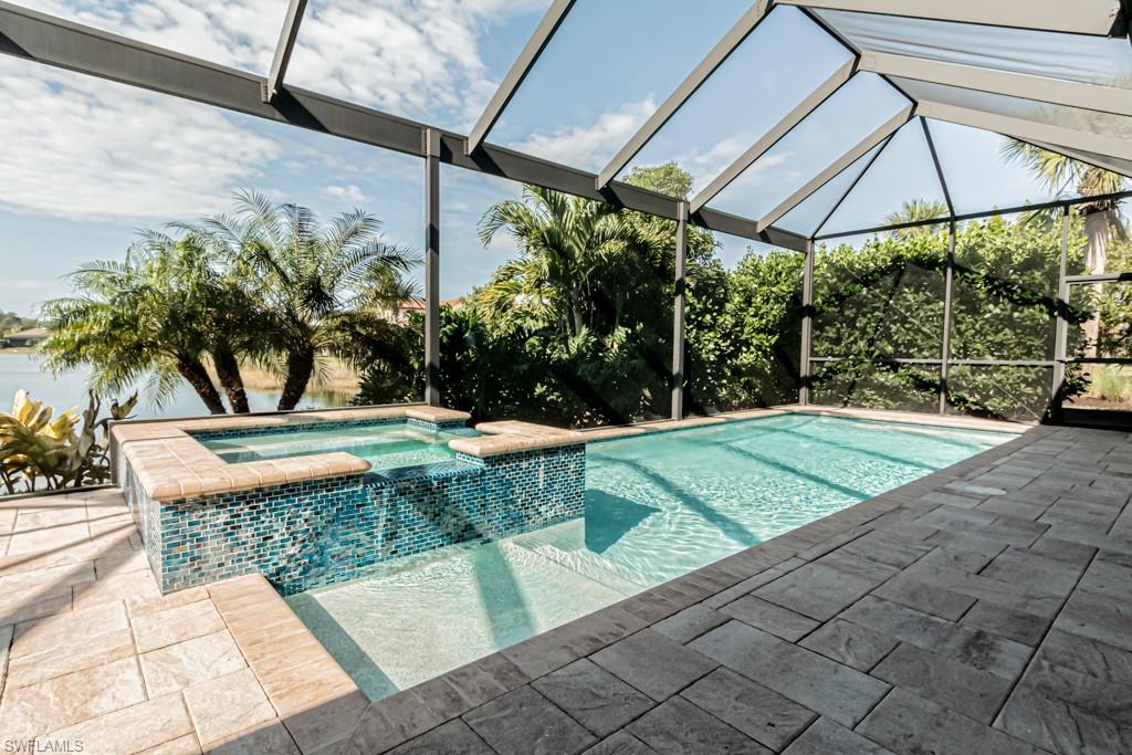 9380 Glenforest Drive Naples, FL 34120 - Photo 42 of 49 a view of a backyard with a patio