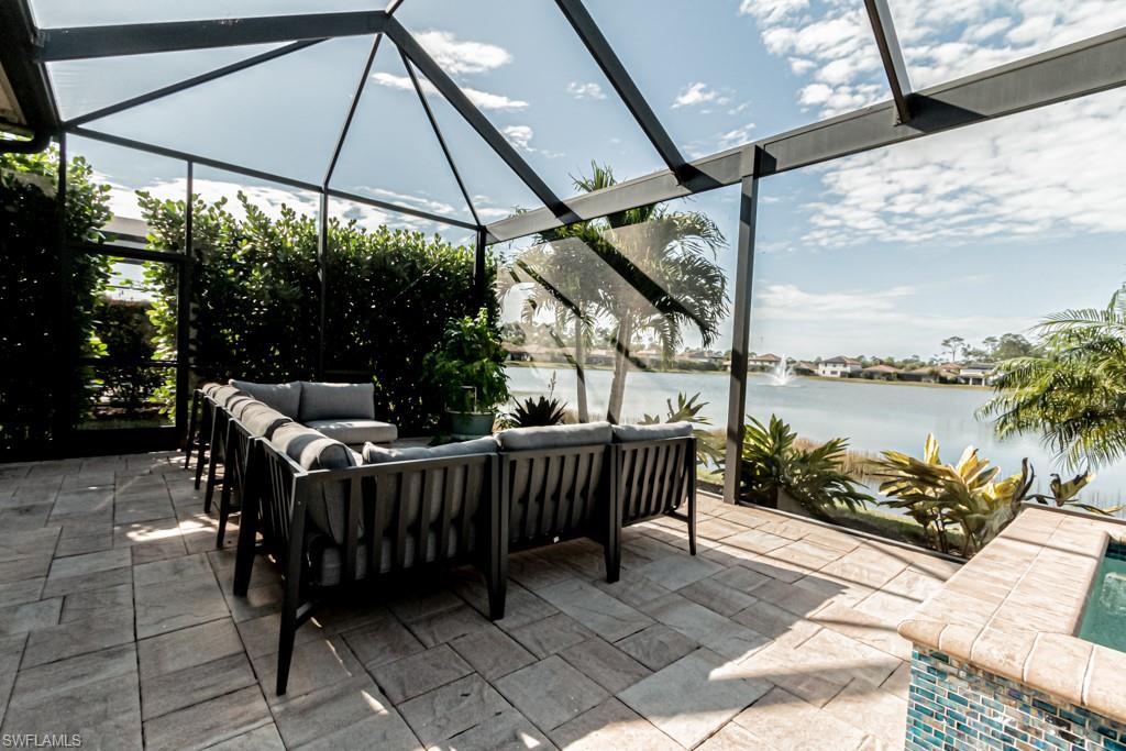 9380 Glenforest Drive Naples, FL 34120 - Photo 45 of 49 a view of a chair and tables in the patio