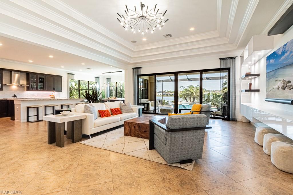 9380 Glenforest Drive Naples, FL 34120 - Photo 8 of 49 a living room with furniture and a large window