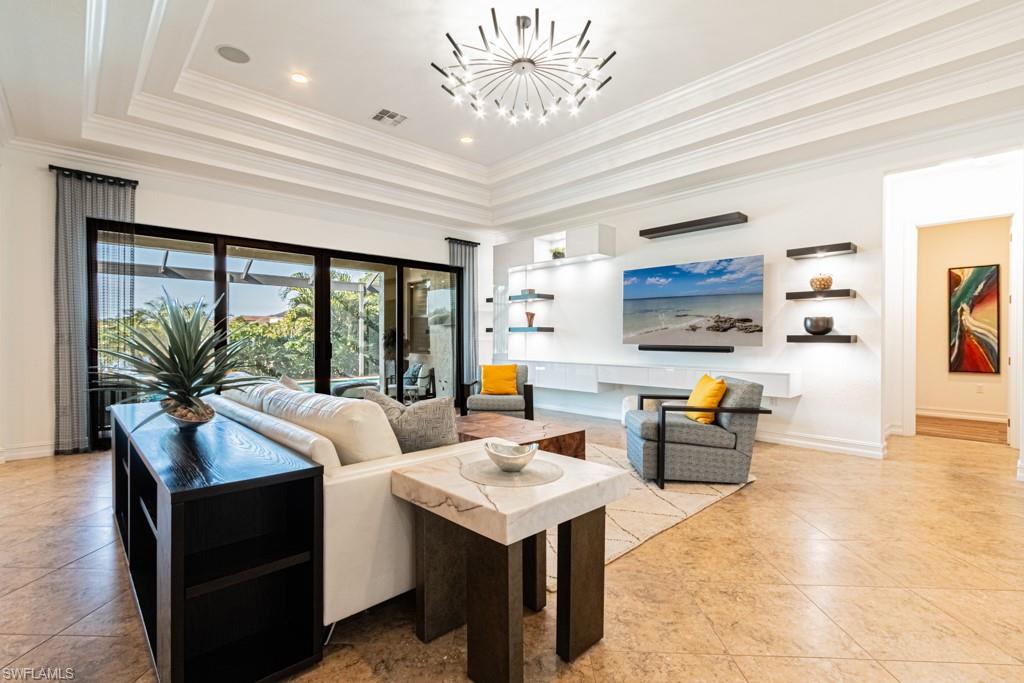 9380 Glenforest Drive Naples, FL 34120 - Photo 10 of 49 a living room with furniture and a large window