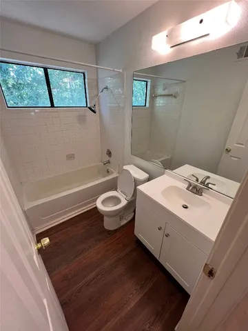 a bathroom with a sink a toilet and a bathtub