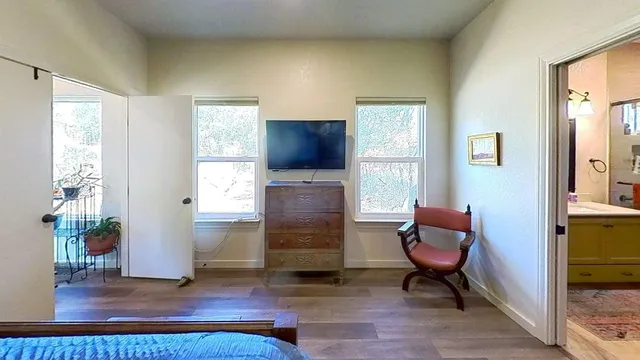 a spacious bathroom with a granite countertop shower and a sink