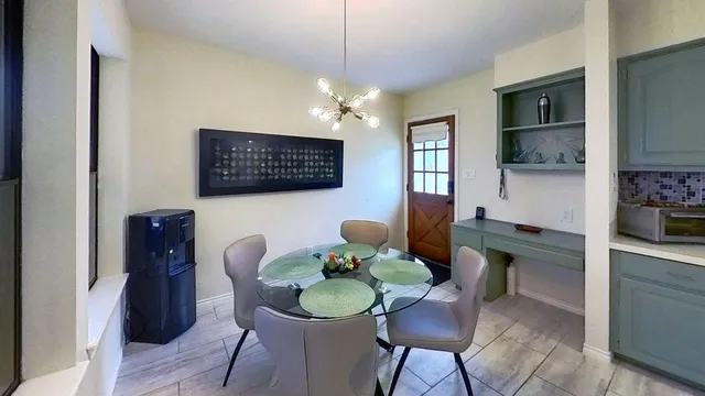a dining room with furniture and window
