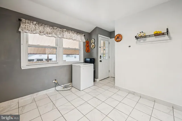 a view of a storage & utility room with a window