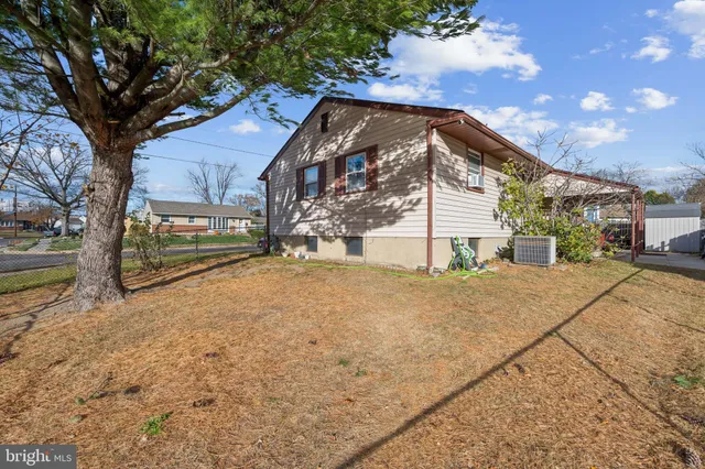 a view of a house with a snow in the yard