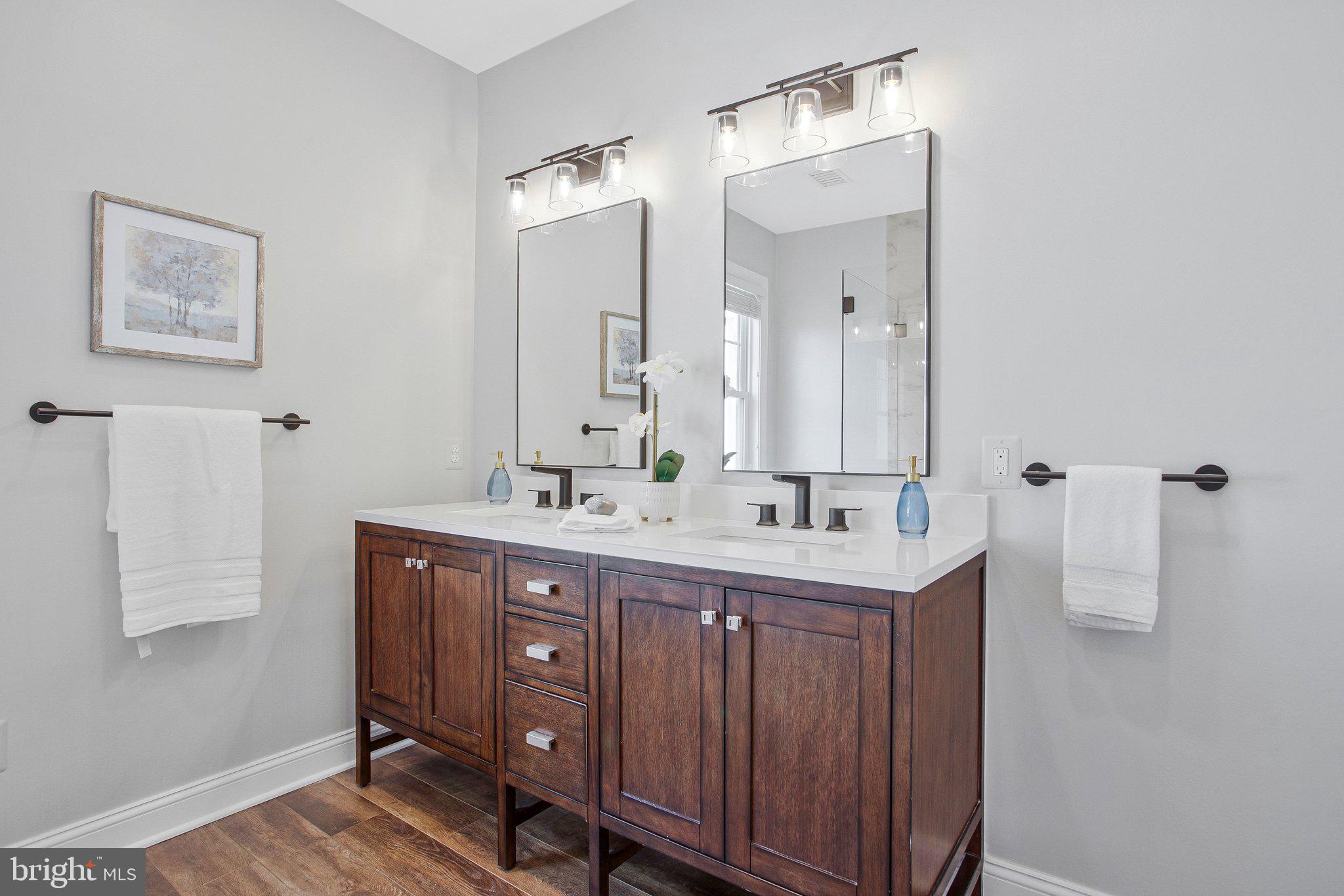6146 Drum Point Road Deale, MD 20751 - Photo 39 of 75 a bathroom with a sink and a mirror