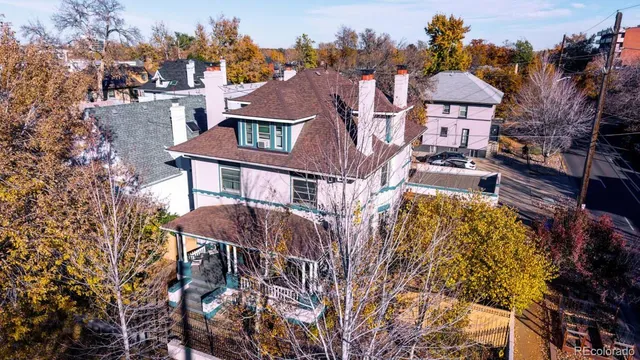 a aerial view of a house with a yard patio and fire pit