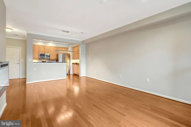 a kitchen with stainless steel appliances a refrigerator and a stove top oven