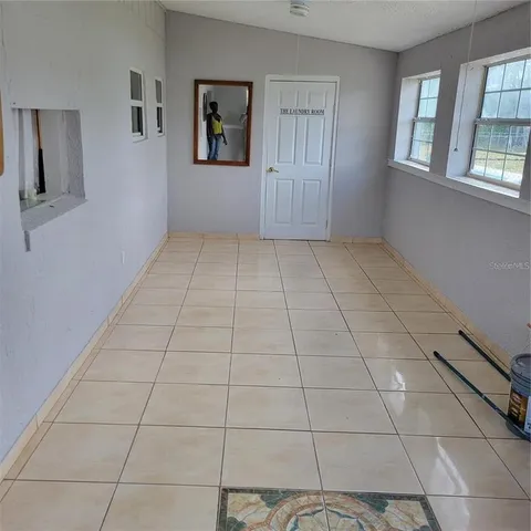 a view of an empty room with windows