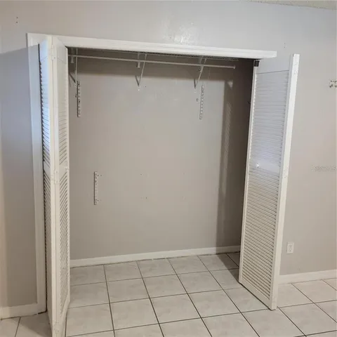 a view of an empty walk in closet