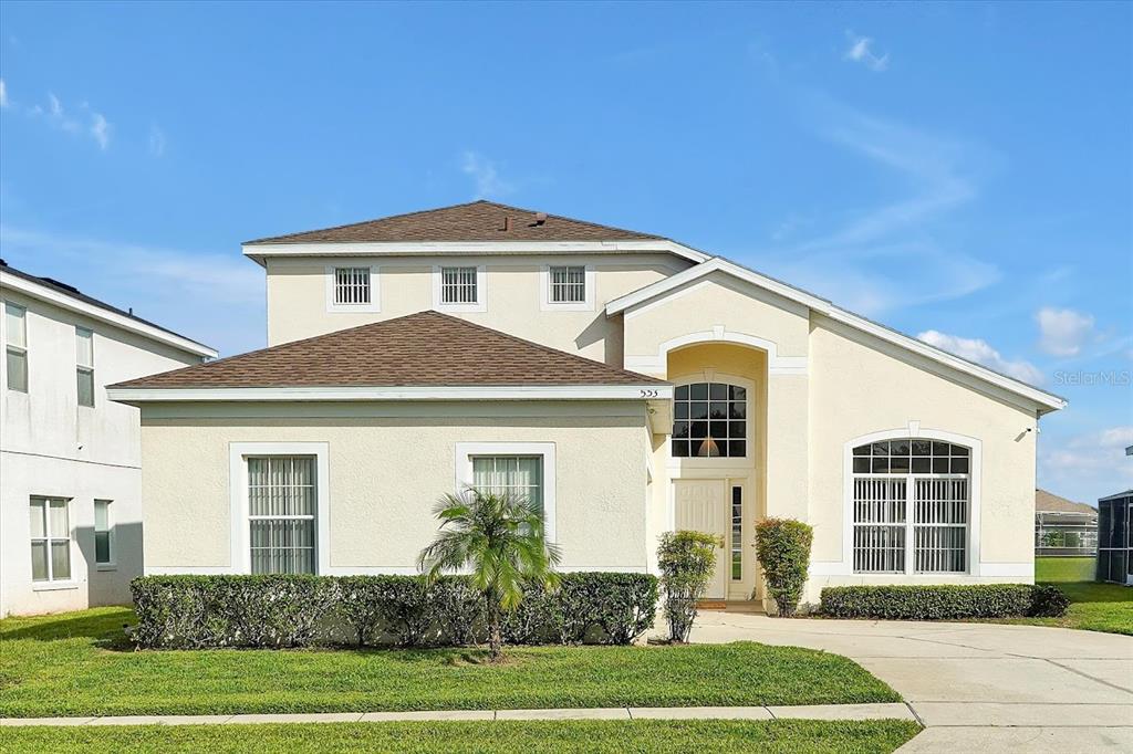 a front view of a house with a yard