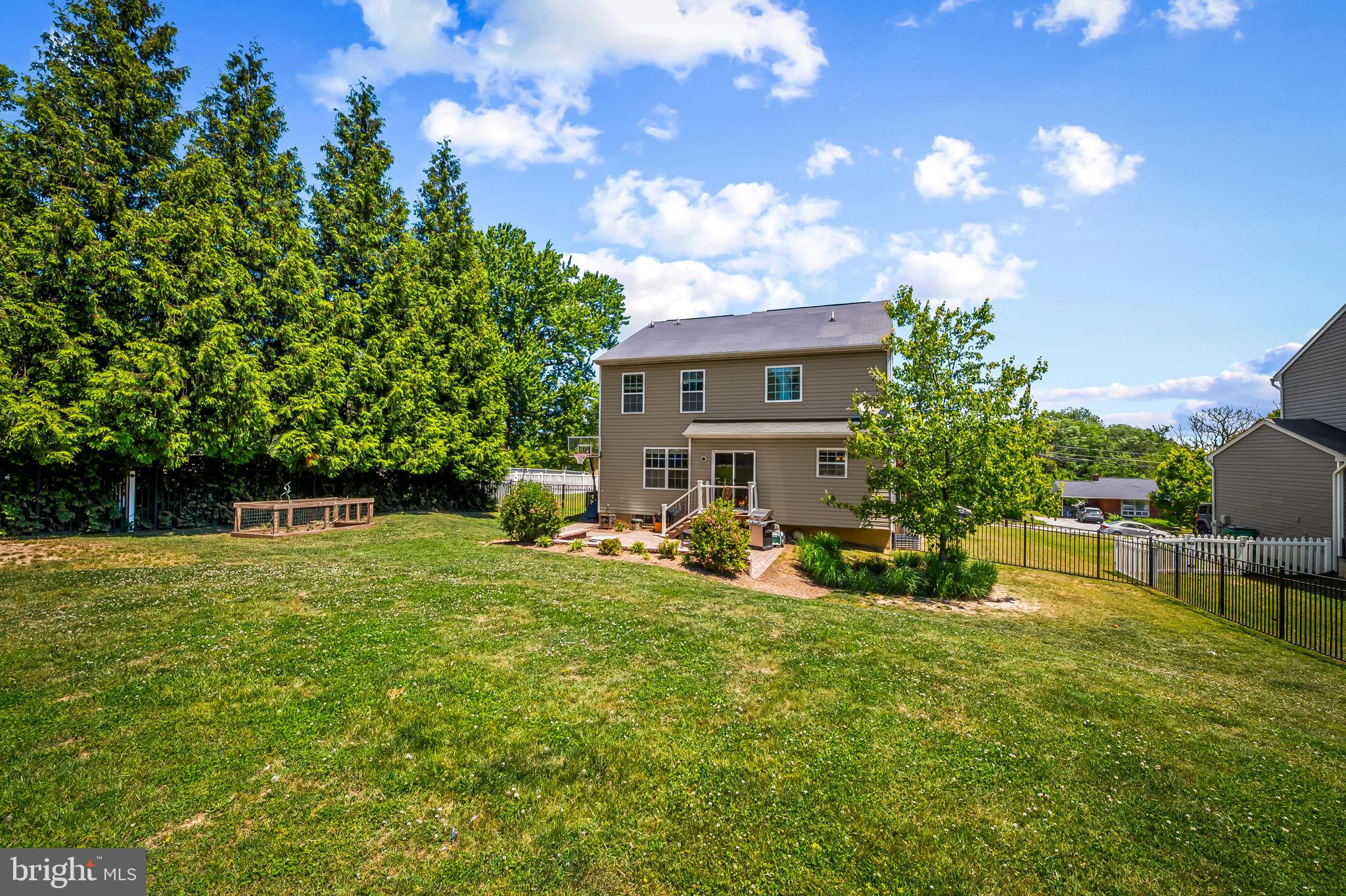 6008 Hanover Road Elkridge, MD 21075 - Photo 33 of 36 a view of a house with a yard porch and sitting area