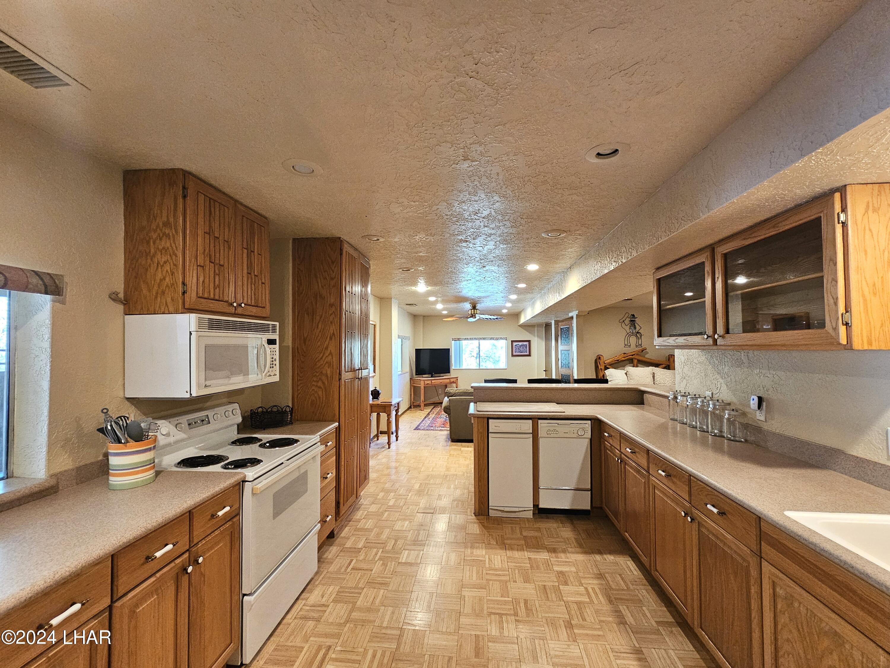 6599 Flag Mine Road Kingman, AZ 86401 - Photo 50 of 63 VIEW TOWARDS LIVING ROOM FROM KITCHEN.