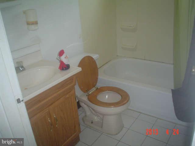 1818 Swansea Road Baltimore, MD 21239 - Photo 7 of 11 a bathroom with a sink and a vanity