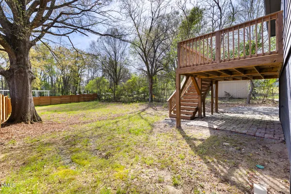 a view of outdoor space with deck and a garden