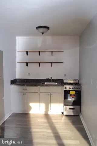 a view of workspace with wooden floor