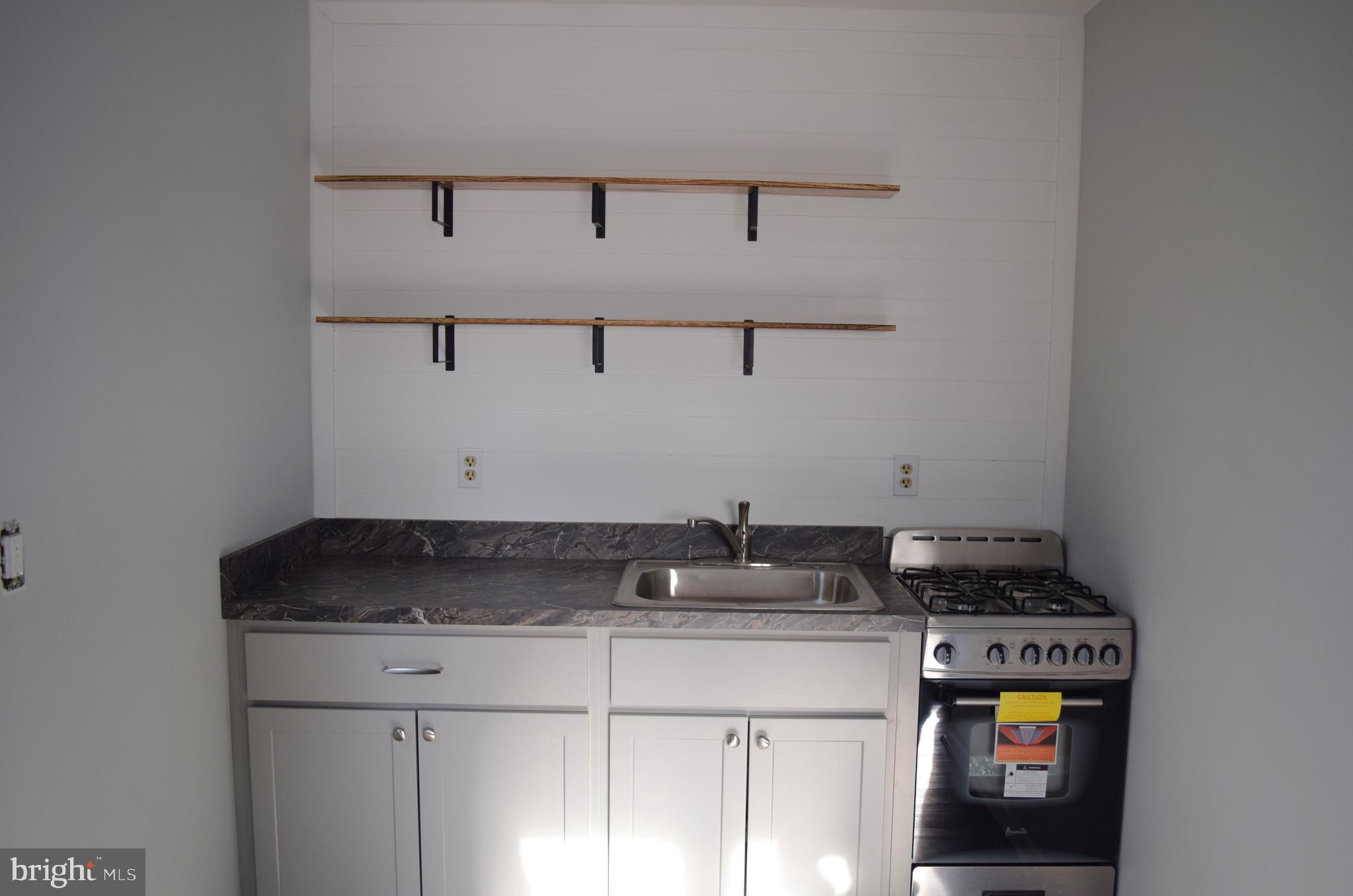 901 Laurel Street, Unit 1 Lebanon, PA 17046 - Photo 4 of 9 a view of a storage and utility room with washer and dryer