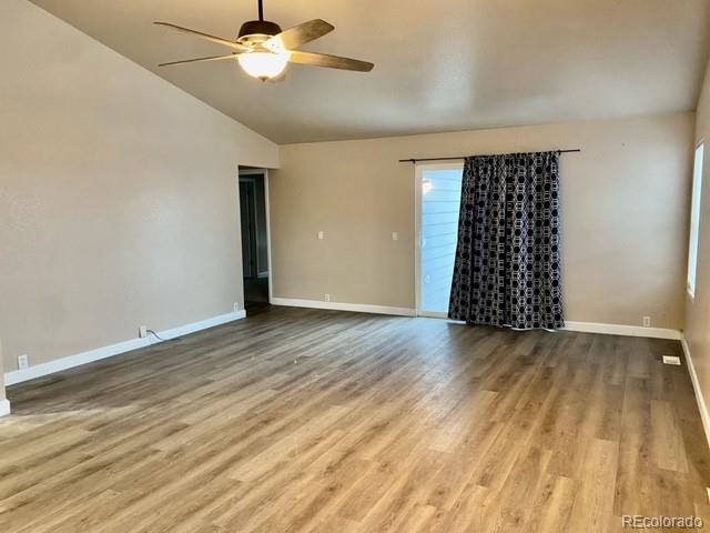 12337 Crystal Downs Road Peyton, CO 80831 - Photo 12 of 22 wooden floor in an empty room with a window